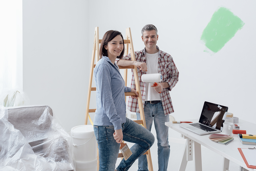 Couple Painting Their House